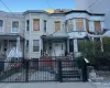 View of front of house featuring a gate, a fenced front yard, and a porch View of front of house featuring a gate, a fenced front yard, and a porch