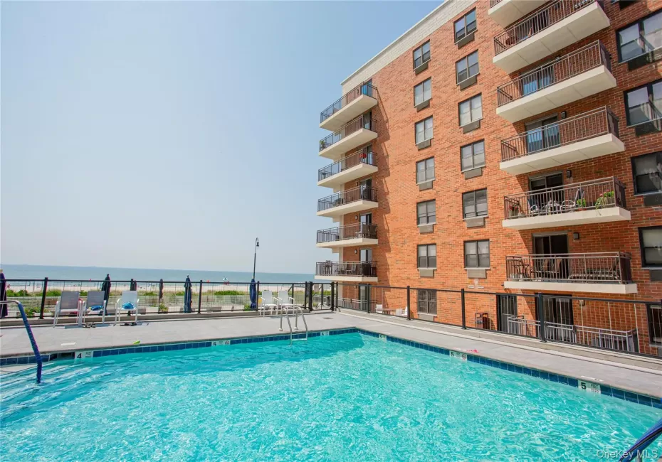 Community pool with a water view Community pool with a water view