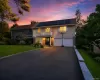 Front of home featuring attached 2 car garage and spacious driveway Front of home featuring attached 2 car garage and spacious driveway