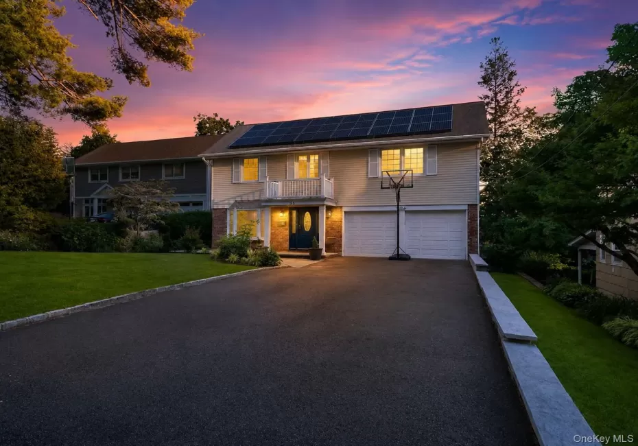 Front of home featuring attached 2 car garage and spacious driveway Front of home featuring attached 2 car garage and spacious driveway