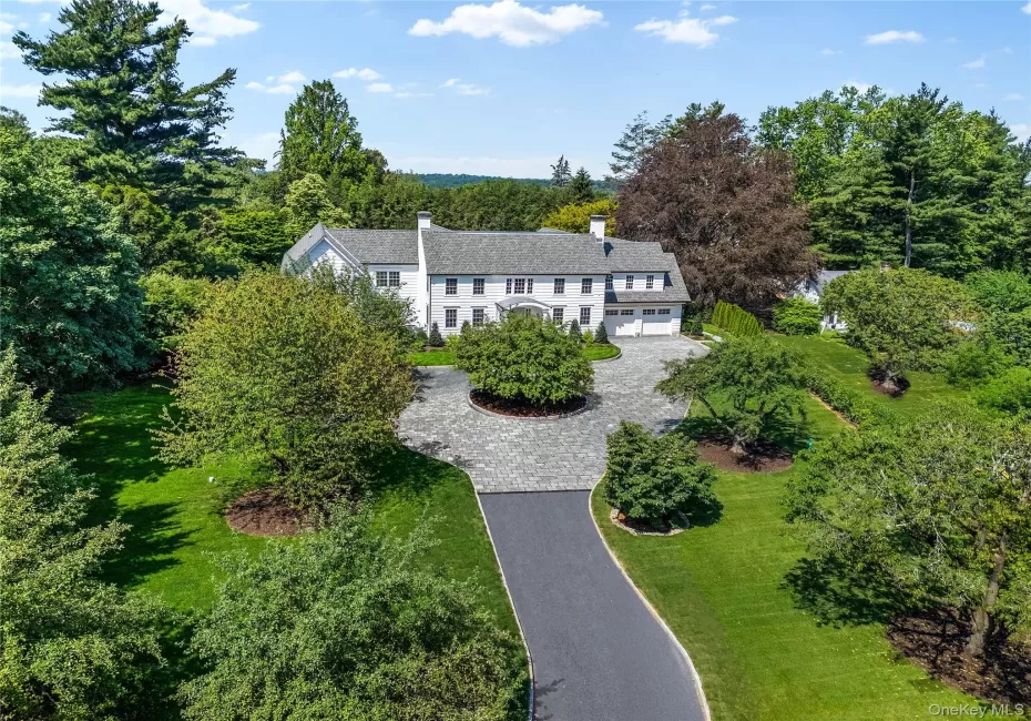 Set way back beyond a grand gated entrance this impressive home creates an unforgettable first impression, surrounded by beautifully landscaped 1.5-acre grounds with specimen trees in the heart of the sought-after Murray Hill estate neighborhood in Scarsdale. Set way back beyond a grand gated entrance this impressive home creates an unforgettable first impression, surrounded by beautifully landscaped 1.5-acre grounds with specimen trees in the heart of the sought-after Murray Hill estate neighborhood in Scarsdale.