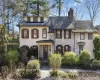 View of front of property with stone siding and a chimney View of front of property with stone siding and a chimney
