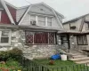 View of home's exterior with a gambrel roof and stone siding View of home's exterior with a gambrel roof and stone siding