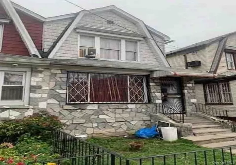 View of home's exterior with a gambrel roof and stone siding View of home's exterior with a gambrel roof and stone siding