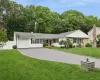Contemporary ranch-style residence featuring a combination of white siding and stone facade Contemporary ranch-style residence featuring a combination of white siding and stone facade