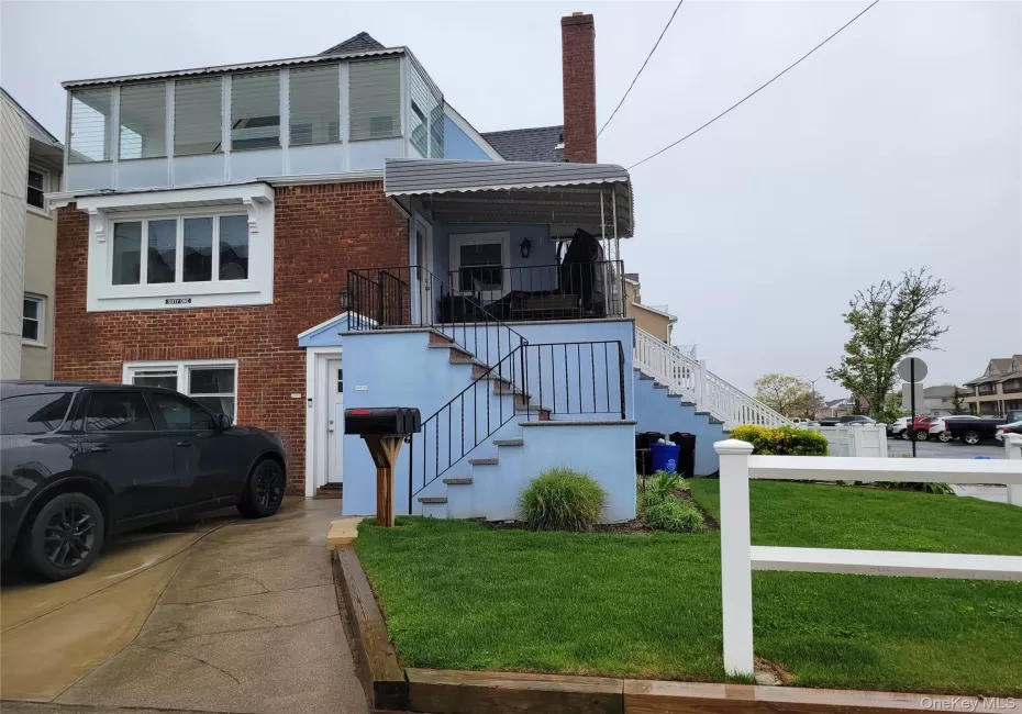 View of front of home with a chimney, brick siding, a front yard, View of front of home with a chimney, brick siding, a front yard,
