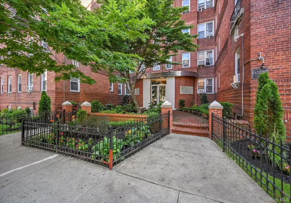 Front entrance with immaculately maintained landscaping offers a warm welcome to this pre-war building Front entrance with immaculately maintained landscaping offers a warm welcome to this pre-war building