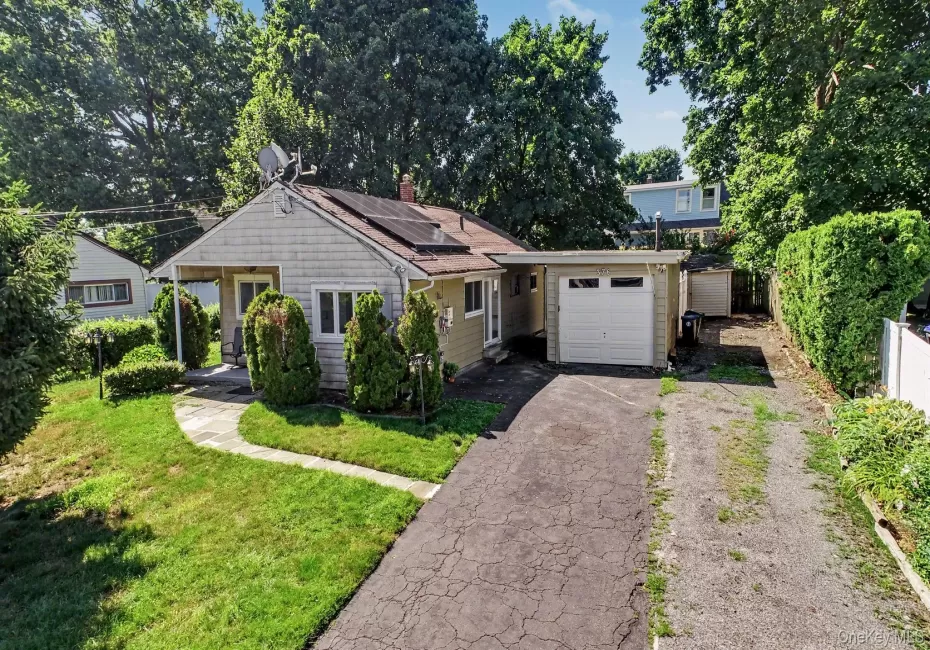Home view with plenty of parking and a workshop. Home view with plenty of parking and a workshop.