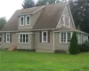 Rear view of property with a yard Rear view of property with a yard