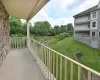 Extra large balcony with beautiful view of landscaping and pond with waterfall. Extra large balcony with beautiful view of landscaping and pond with waterfall.