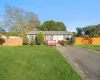 Single story home with asphalt driveway Single story home with asphalt driveway