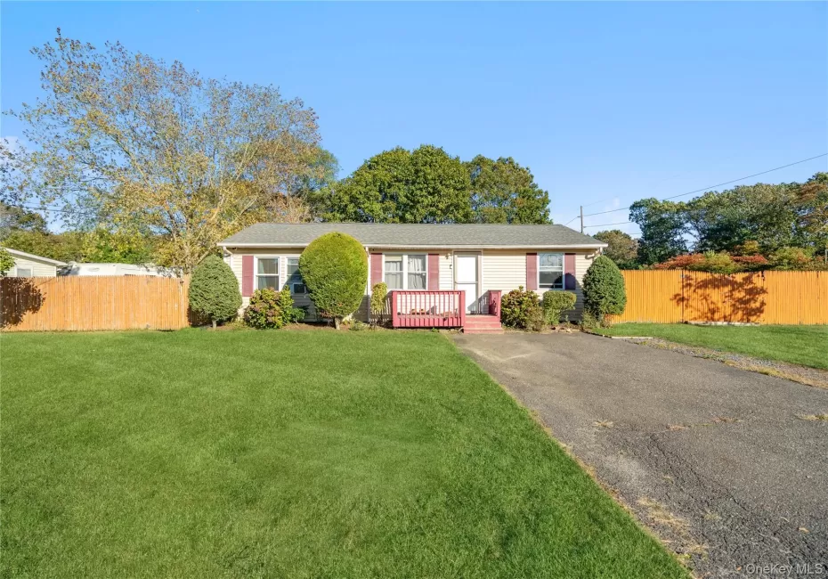 Single story home with asphalt driveway Single story home with asphalt driveway