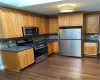 Kitchen with stainless appliances and granite countertops. Kitchen with stainless appliances and granite countertops.