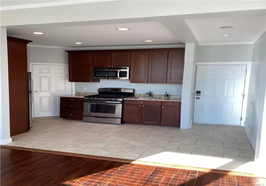 Open Floor plan kitchen and living room. Stainless Appliances, granite counters, hardwood floors. Open Floor plan kitchen and living room. Stainless Appliances, granite counters, hardwood floors.
