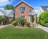 View of front of home with a front lawn and brick siding View of front of home with a front lawn and brick siding