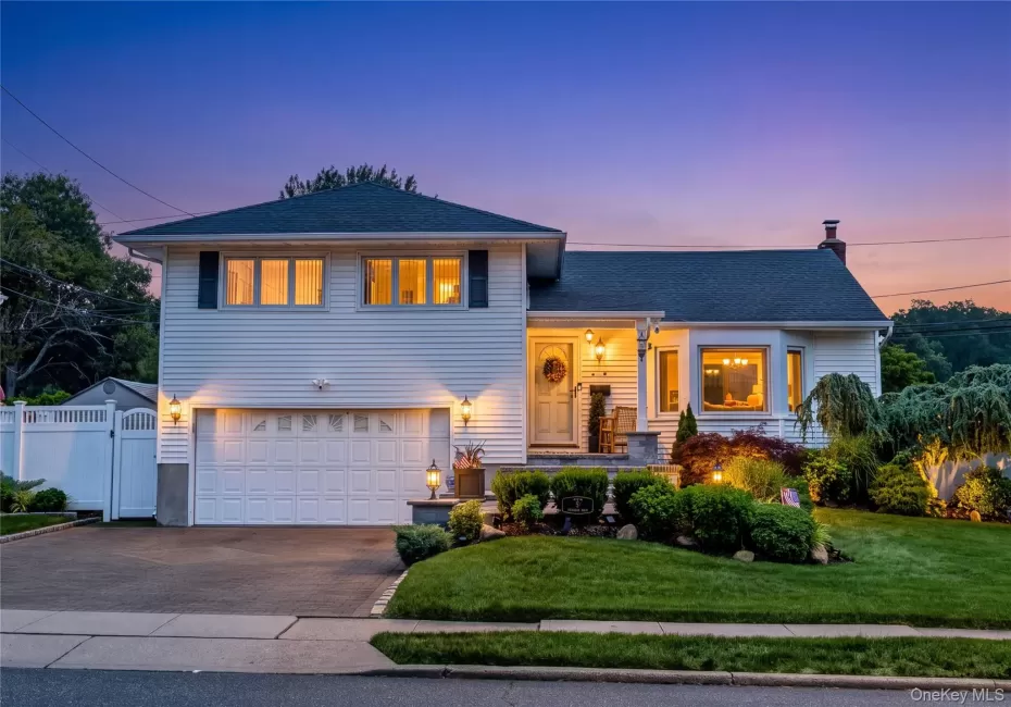 Stunning Landscaping. Paver Driveway and front patio. Amazing Curb Appeal. Edited to show home in Dusk Stunning Landscaping. Paver Driveway and front patio. Amazing Curb Appeal. Edited to show home in Dusk