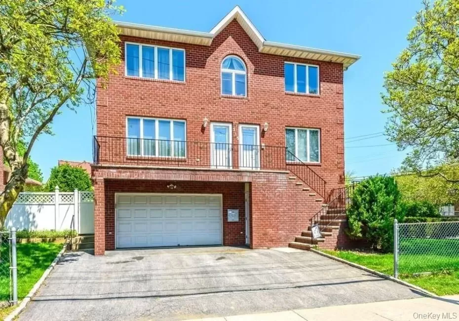 Front elevation with parking. Front elevation with parking.