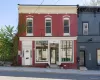 Italianate house with brick siding and entry steps Italianate house with brick siding and entry steps
