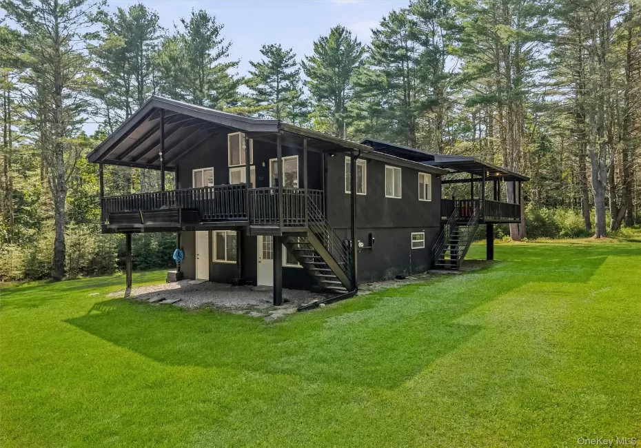 Front angled view, stairs to main level porch and entry door. Lower entry door Front angled view, stairs to main level porch and entry door. Lower entry door