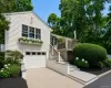 Coastal home with water view, garage, windows with box planters, spacious deck and yard Coastal home with water view, garage, windows with box planters, spacious deck and yard