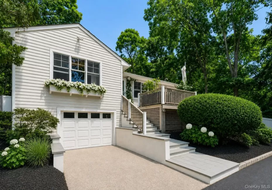 Coastal home with water view, garage, windows with box planters, spacious deck and yard Coastal home with water view, garage, windows with box planters, spacious deck and yard