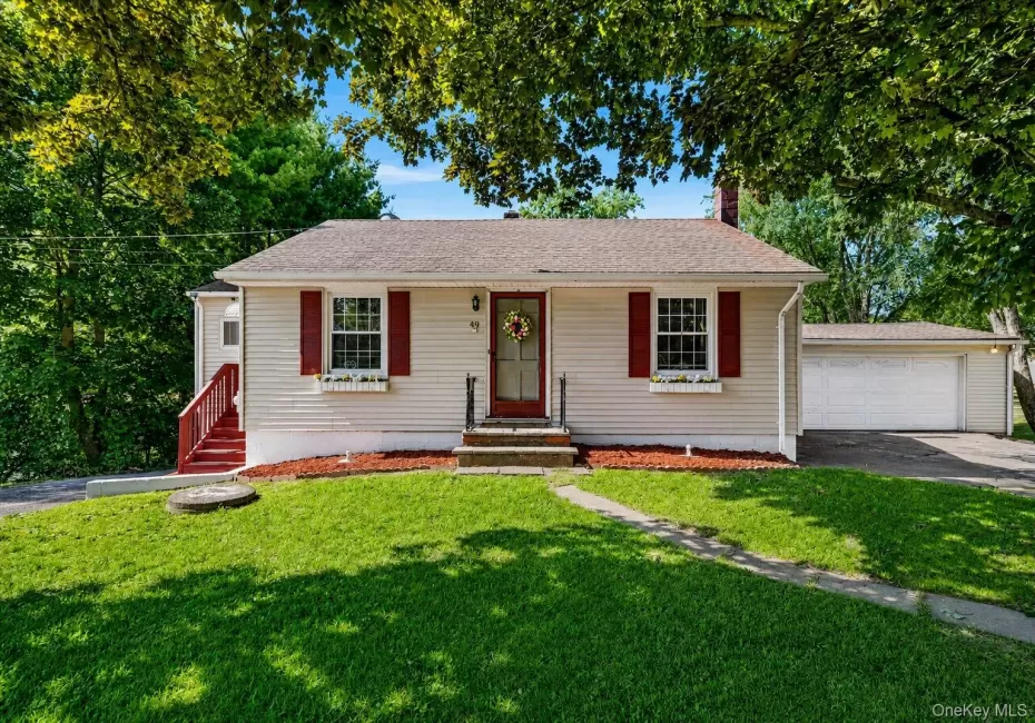 Welcome to 49 Chase Road! Charming front view framed by mature shade trees, featuring landscaped garden beds, a welcoming entrance, and an attached garage. Welcome to 49 Chase Road! Charming front view framed by mature shade trees, featuring landscaped garden beds, a welcoming entrance, and an attached garage.