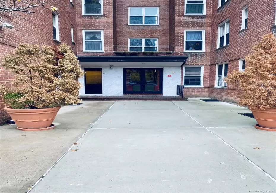 Brick facade building featuring multiple window configurations Brick facade building featuring multiple window configurations