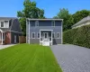 Two-story Colonial home with blue siding Two-story Colonial home with blue siding