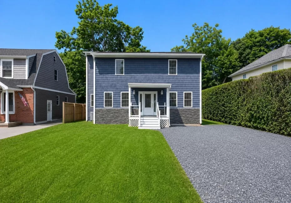 Two-story Colonial home with blue siding Two-story Colonial home with blue siding