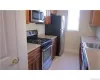 Beautiful kitchen with lots of wood cabinets, counter space, stainless steel appliances and pantry Beautiful kitchen with lots of wood cabinets, counter space, stainless steel appliances and pantry