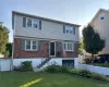 Split-level residence featuring a brick and siding exterior Split-level residence featuring a brick and siding exterior