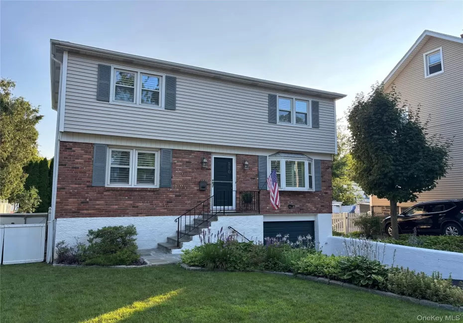 Split-level residence featuring a brick and siding exterior Split-level residence featuring a brick and siding exterior