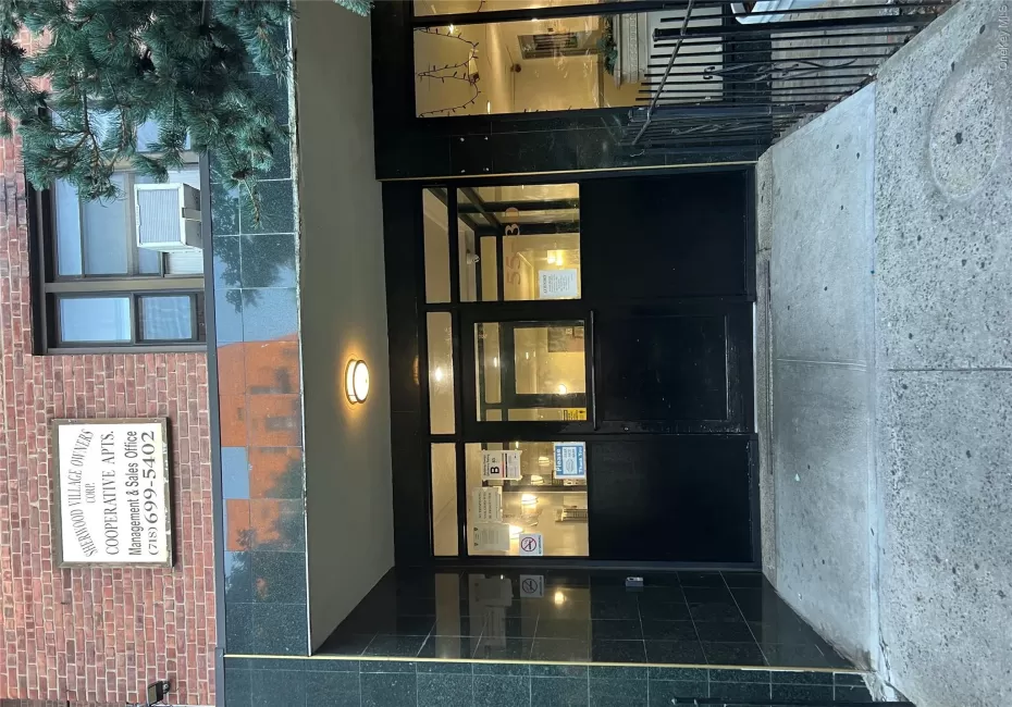 Property entrance with brick siding Property entrance with brick siding