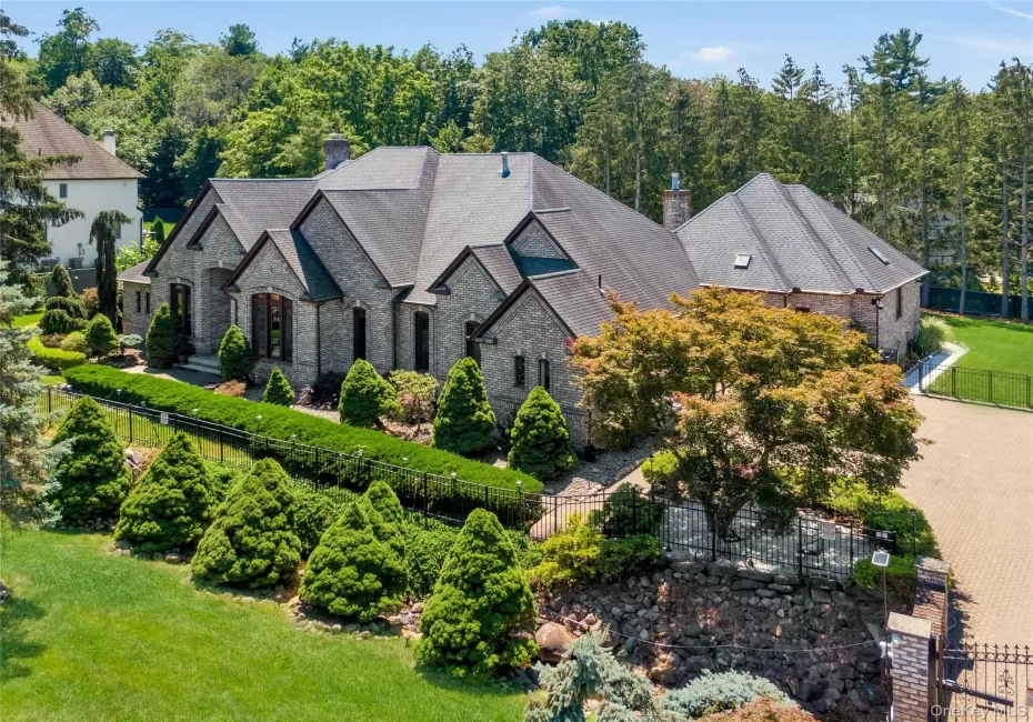 French County style exterior with country club backyard In-ground pool French County style exterior with country club backyard In-ground pool