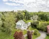 View from above of property with a heavily wooded area View from above of property with a heavily wooded area