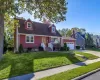 Rear dormered Cape with two car detached garage Rear dormered Cape with two car detached garage