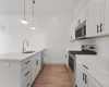 Kitchen with a large Island and stainless steel appliances Kitchen with a large Island and stainless steel appliances