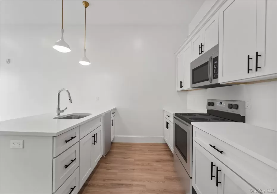 Kitchen with a large Island and stainless steel appliances Kitchen with a large Island and stainless steel appliances
