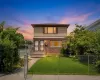 Two-story residence featuring a brick first level and siding on the second level Two-story residence featuring a brick first level and siding on the second level