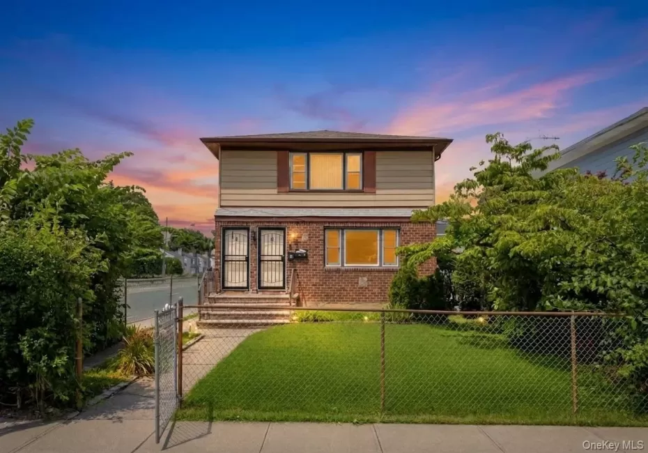 Two-story residence featuring a brick first level and siding on the second level Two-story residence featuring a brick first level and siding on the second level
