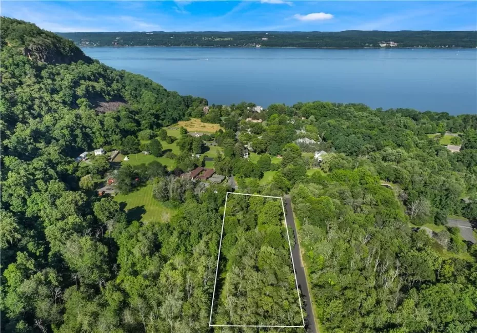 Aerial view featuring a water view Aerial view featuring a water view