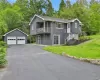 Balcony overlooking the side of the home, 2 car detached garage and driveway. Balcony overlooking the side of the home, 2 car detached garage and driveway.