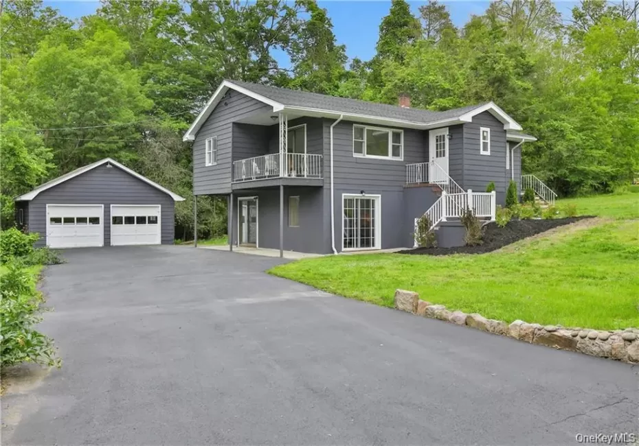 Balcony overlooking the side of the home, 2 car detached garage and driveway. Balcony overlooking the side of the home, 2 car detached garage and driveway.