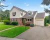 Traditional two-story residence featuring brick and siding facade Traditional two-story residence featuring brick and siding facade