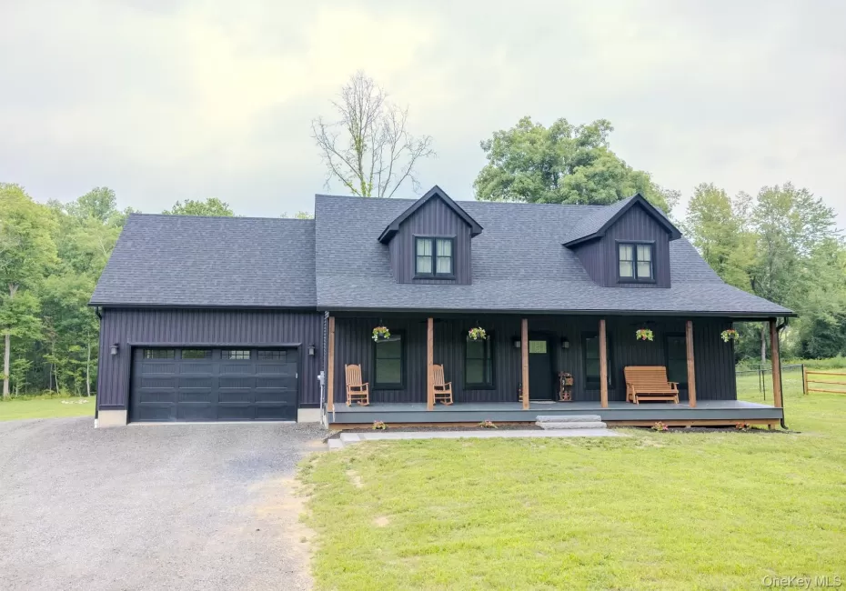 A full-length covered front porch creates a warm first impression, offering multiple places to relax, gather and enjoy the peaceful setting before you ever step inside. A full-length covered front porch creates a warm first impression, offering multiple places to relax, gather and enjoy the peaceful setting before you ever step inside.