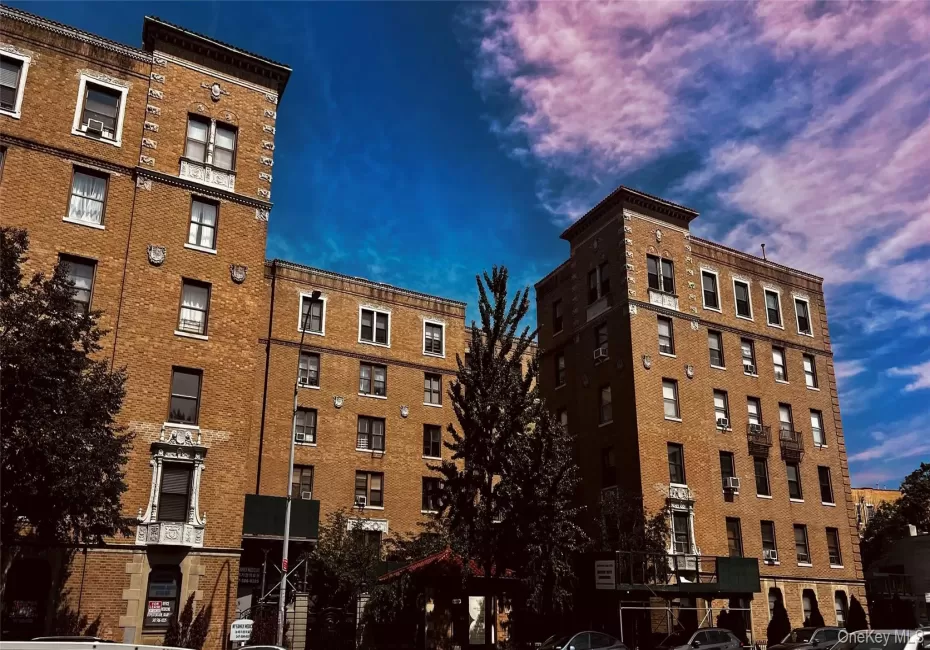 Multi-story brick facade buildings featuring decorative cornices and window surrounds Multi-story brick facade buildings featuring decorative cornices and window surrounds