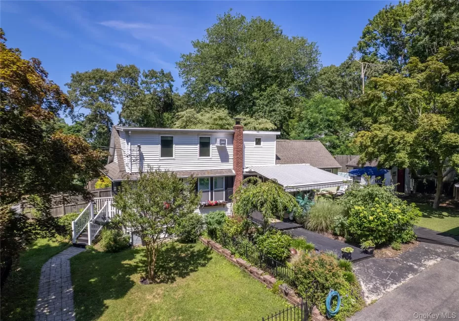Extensive flowering gardens surround this unique property Extensive flowering gardens surround this unique property
