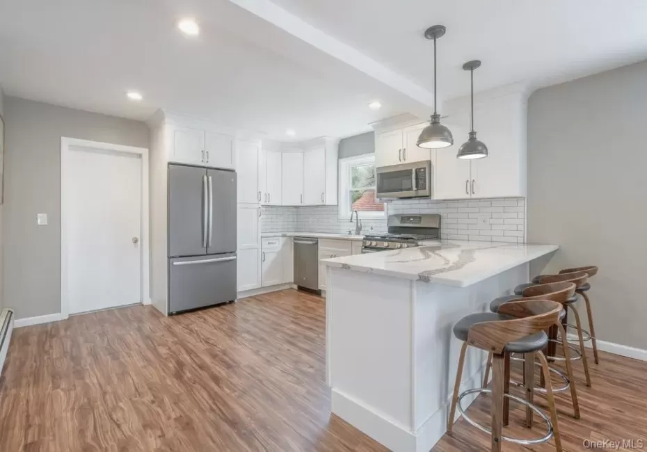 Renovated Kitchen with Quartz Countertops, GE Appliances Renovated Kitchen with Quartz Countertops, GE Appliances