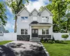 Colonial features: stacked stone detail front covered porch, asphalt double driveway, professionally landscaped with inground sprinklers Colonial features: stacked stone detail front covered porch, asphalt double driveway, professionally landscaped with inground sprinklers