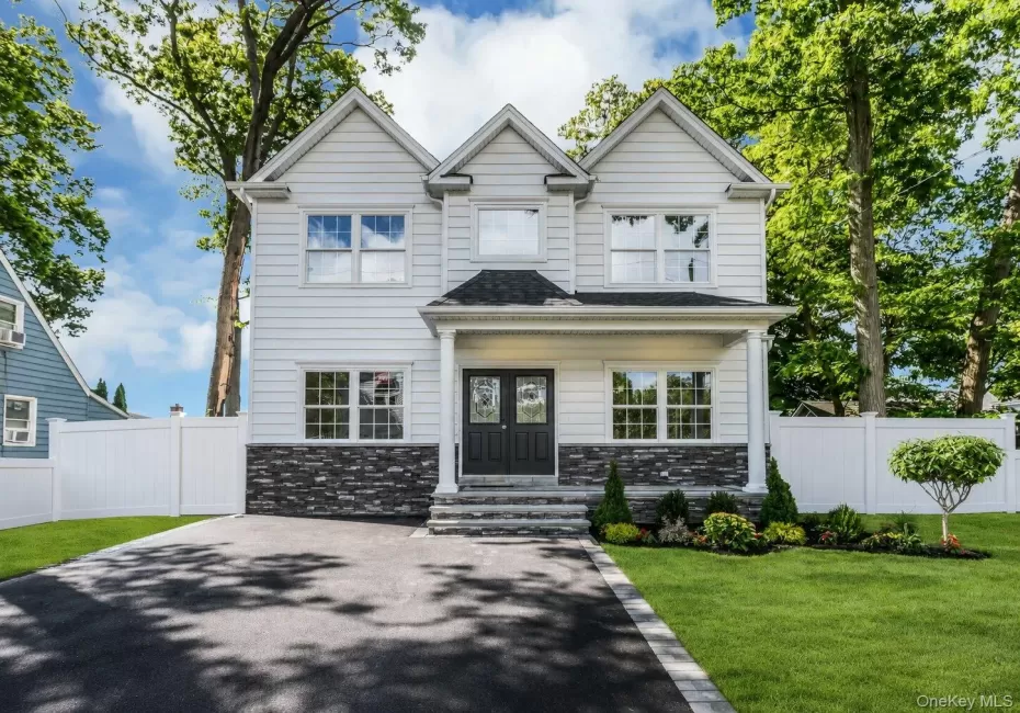 Colonial features: stacked stone detail front covered porch, asphalt double driveway, professionally landscaped with inground sprinklers Colonial features: stacked stone detail front covered porch, asphalt double driveway, professionally landscaped with inground sprinklers
